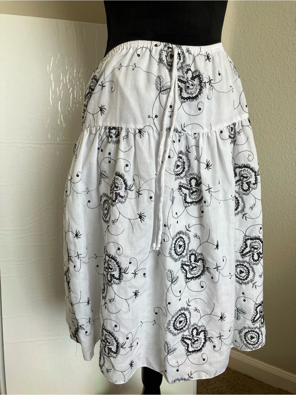 White Tiered Midi Skirt with Black Floral Embroidery